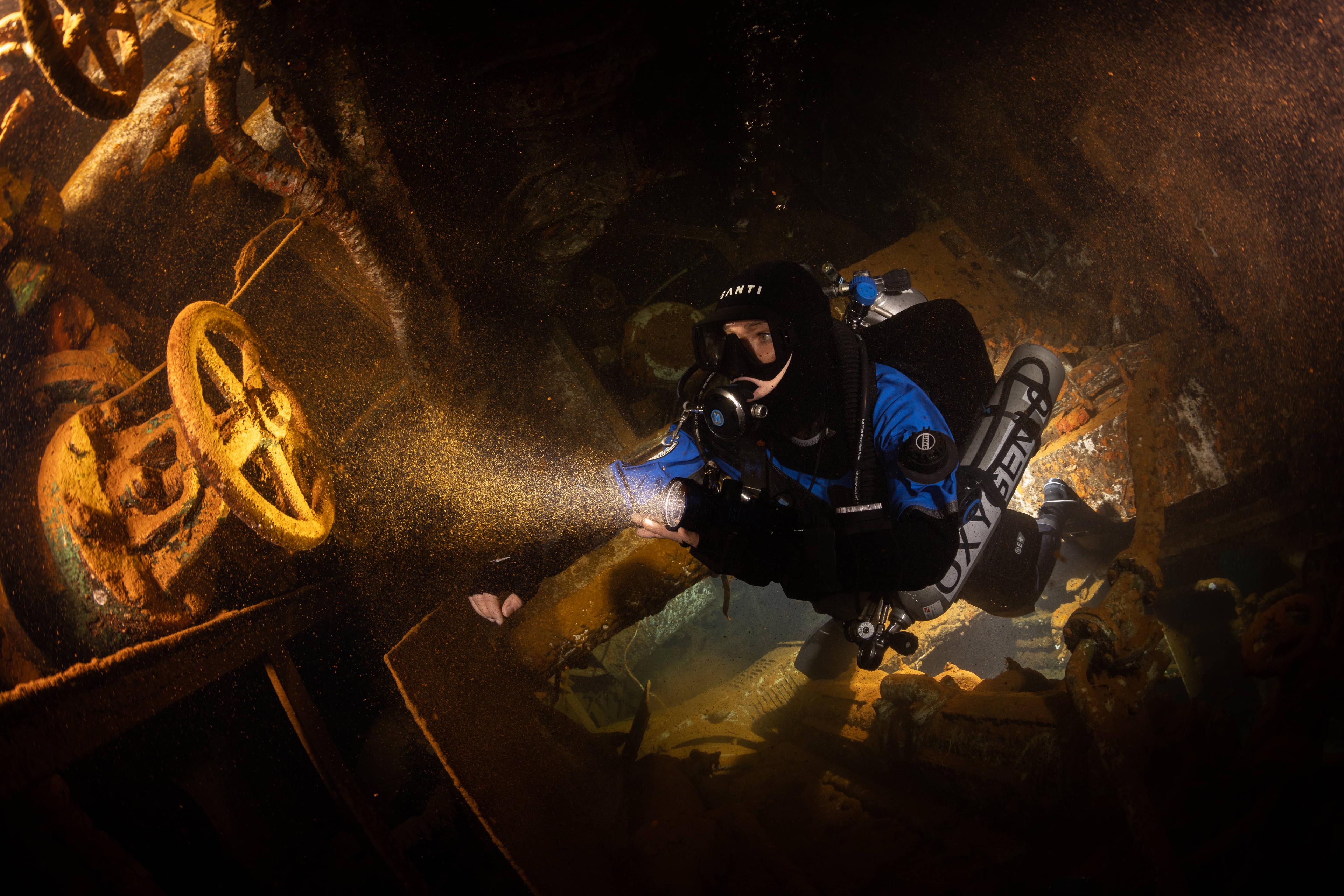 scuba diver in a wreck halcyon